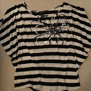 Waste length top. Will go with any skirt or jeans.